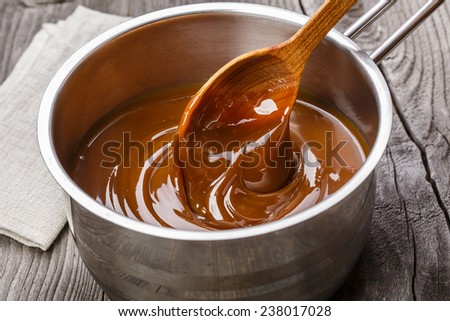 liquid caramel is poured into a gravy boat