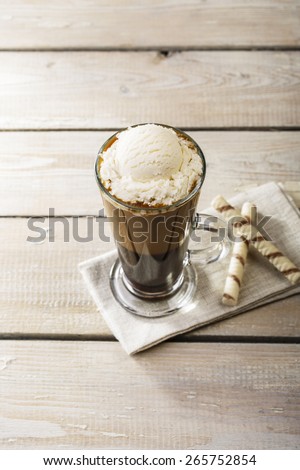 cold coffee with ice cream in a glass