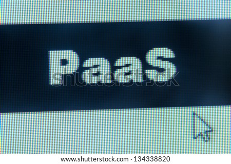 Cloud computing concept - PaaS word and cursor on computer monitor