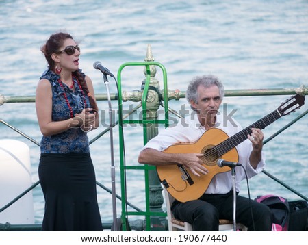 SYDNEY, AUSTRALIA - FEB 08, 2014: Two unidentified street musician sing on Circular quay in Sydney, Australia
