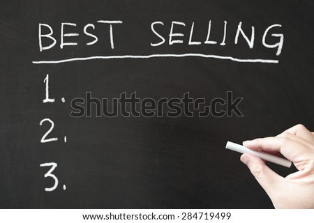 Best selling list written on the blackboard using chalk
