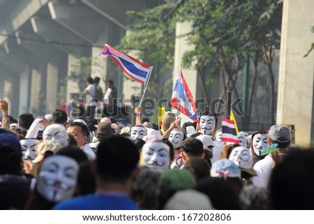 BANGKOK - DEC 9: Many Masked protesters walked for anti government corruption on December 09, 2013 in Bangkok, Thailand. The protesters required Yingluck Shinawatra Prime Minister resign.