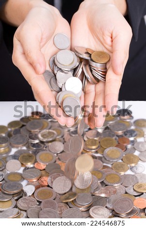Women throw money coin for deposit money for investment in the future