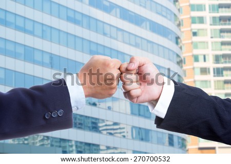 Businessman touch hands for deal thier business.