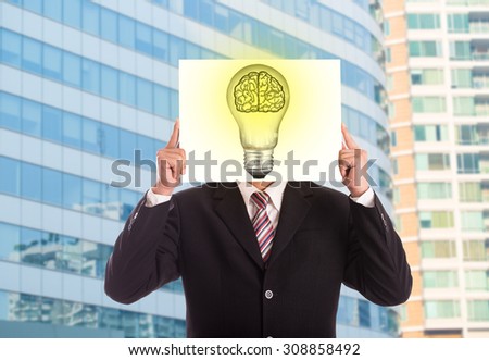 Businessman holding paper Idea lamp creative business