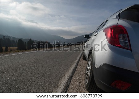 Similar – Image, Stock Photo Car stoped on the road with view of typical rural Icelandic Church with red roof in Vik region. Iceland