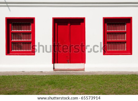 A Red Door and Two Red Window in Thailand Temple.