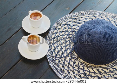 Summer coffee break , female straw  hat and two cups of espresso