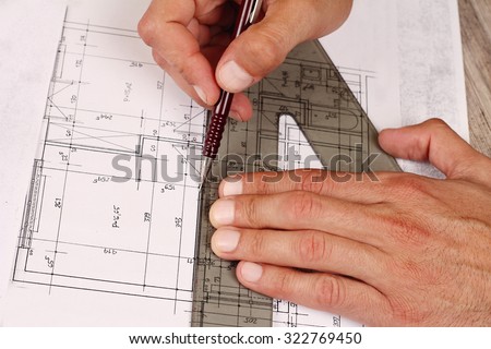 Architectural drawing. Close up on Architect drawing a construction project (plan,house )