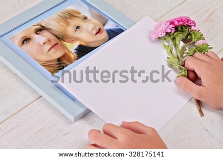 Blank message card and Portrait of mother and son. Child holding flowers. Family time. Kinds and parents. Happy mothers day, happy 8th march concept