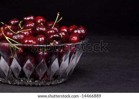 Shot of a freshly washed bowl of cherries in a crystal bowl.