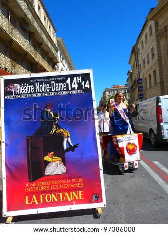 AVIGNON, FRANCE - JULY 18: Unidentified actors perform in the street, to advertise their theater show, during the Avignon Theater Festival in Avignon, France on July 18, 2011.