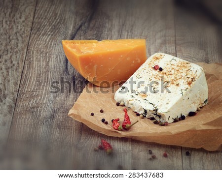 Two kinds of cheese  on the wooden table