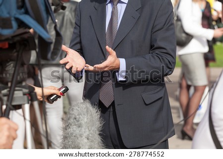 Journalist making media interview with businessman