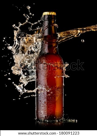 Beer bottle splash with drops
