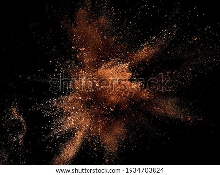 Cocoa powder mixed with few of dry milk explosion on black background Photo stock © 