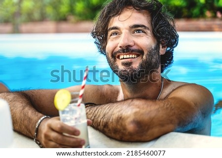Portrait of a hairy man relaxing by drinking a refreshing cocktail and chatting with friends while taking a bath in the pool - concept of summer vacation and carefree life outdoors Photo stock © 