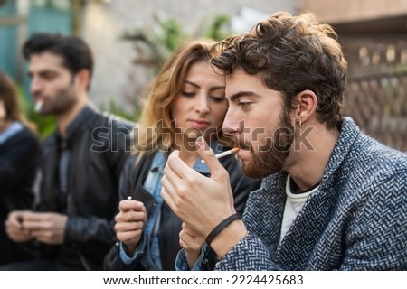 Similar – Image, Stock Photo Young man smoking cigarette in the night