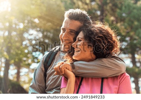 Similar – Image, Stock Photo Loving man and woman supporting each other while standing back to back