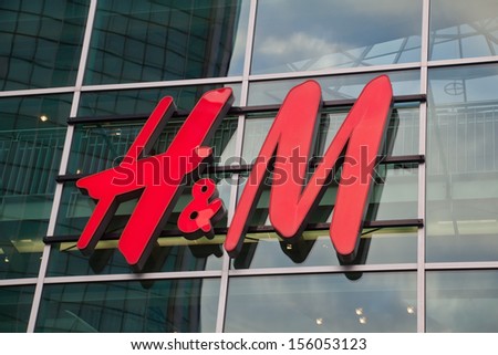 ROTTERDAM, NETHERLANDS - SEPTEMBER 20: logo of the famous textile retail chain Hennes & Mauritz on September 20, 2013 in Rotterdam. It is a swedish company with overall 2.300 branches in 43 countries.