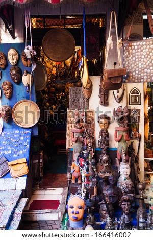 MARRAKESH, MOROCCO - NOVEMBER 15: store with african masks and crafts in the souks on November 15, 2013 in Marrakesh. the souks in the medina of Marrakesh are protected by UNESCO world heritage.