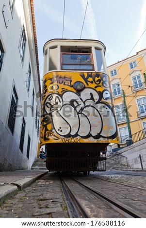 LISBON, PORTUGAL - MAY, 04: funicular with unidentified people on may 04, 2013 in Lisbon. The historical funicular named - Ascensor da Gloria - was opened 1885, with a height difference of 48 meters.
