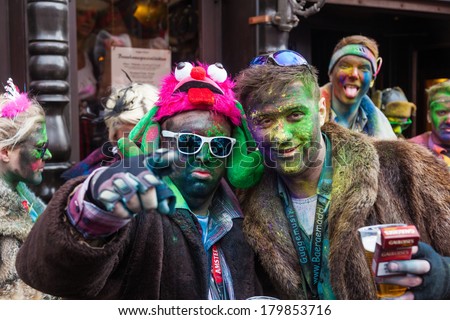 COLOGNE, GERMANY - MARCH 03: unidentified people with painted faces at the Rose Monday parade on March 03, 2014 in Cologne. The Rose Monday parade of Cologne is the largest carnival parade in Germany.