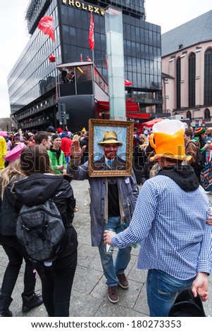 COLOGNE, GERMANY - MARCH 03: unidentified costumed crowd of people at the Rose Monday parade on March 03, 2014 in Cologne. The parade in Cologne is the largest one in Germany.