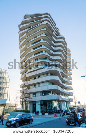 HAMBURG, GERMANY - MARCH 08: Marco Polo Towerwith unidentified people on March 08, 2014 in Hamburg. It is located in the development area HafenCity and is designed by Behnisch architects.