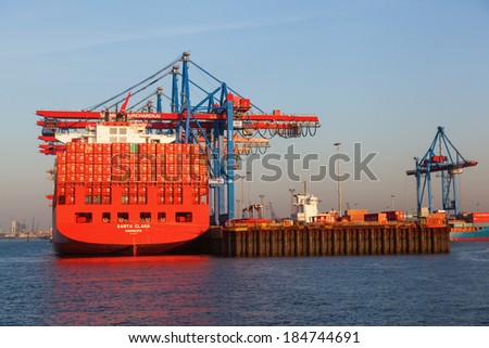 HAMBURG, GERMANY - MARCH 10: container ship Santa Clara of the Hamburg SÃ?Â¼d shipping company in the Burchardkai on March 10, 2014. Burchardkai is the largest container terminal of the Hamurg port.