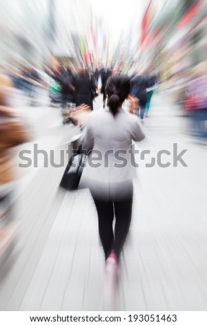 shopping woman in the city with creative zoom effect