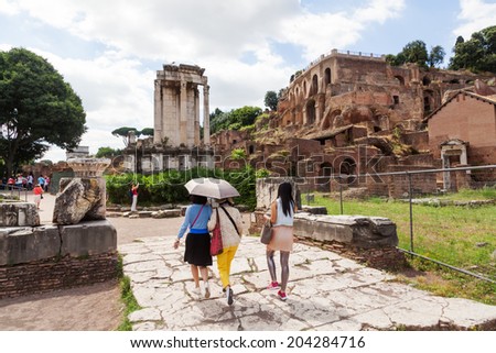 ROME - JUNE 30: Roman Forum with unidentified people on June 30, 2014 in Rome. The anicent forum is today a sprawling ruin of fragments and archaeological excavations for 4.5 million sightseers yearly