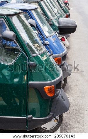 ROME - JULY 01: Piaggio Ape50 in a row on July 01, 2014 in Rome. Piaggio Ape is a three-wheeled light commercial vehicle first produced in 1948 by Piaggio.