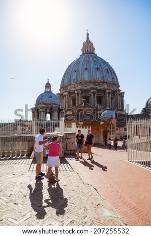 VATICAN CITY - JULY 01: unidentified people on the roof of St Peters Basilica on July 01, 2014 in Vatican City. Its the most famous work of Renaissance and remains the largest church in the world