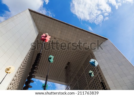PARIS - AUGUST 05: art objects of artist -Takis- in front of the Grande Arche in the district La Defense on August 05, 2014 in Paris. Kinetic objects of the greek sculptor Panagiotis Vasilakis -Takis-