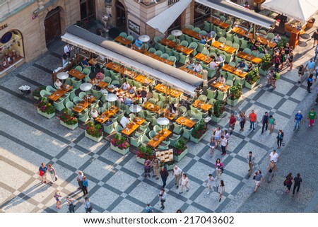 PRAGUE, CZECHIA - SEPTEMBER 04: aerial view of the old town square with street restaurant and unidentified people on September 04, 2014 in Prague. The centre of Prague is protected by UNESCO.