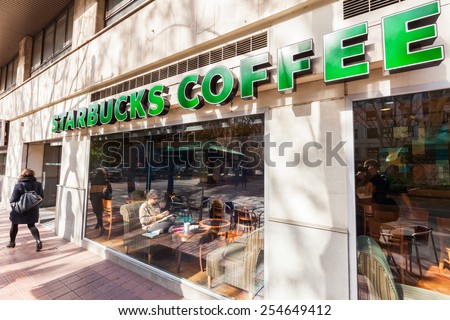 VALENCIA, SPAIN - FEBRUARY 09, 2015: Starbuck Coffee shop in the old town of Valencia with unidentified people. Its world largest Coffee Shop chains with 21,160 stores in 63 countries and territories