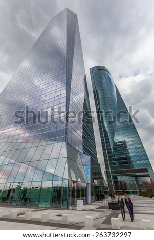 MADRID,SPAIN-MARCH17,2015: towers in the 4 Towers Business Area with tallest skyscrapers in Madrid and Spain -Torre Espacio, Torre de Cristal, Torre PwC and Torre Caja Madrid- and unidentified people