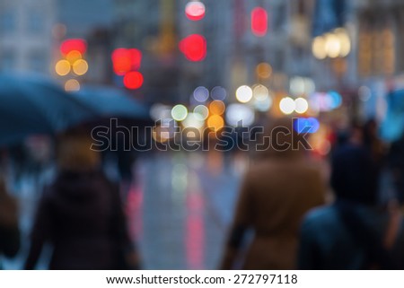 out of focus picture of a rainy city scene at night