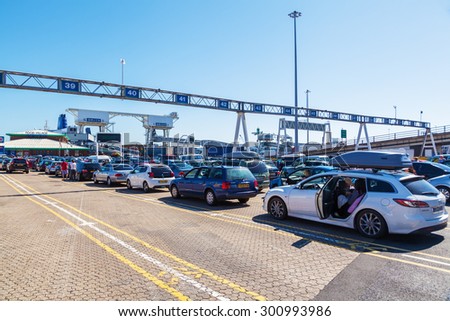 DOVER, ENGLAND - JULY 10, 2015:  Port of Dover, Kent, England, with unidentified people, is the worlds busiest passenger port, with 16 mio travellers, 2.1 mio lorries, 2.8 mio cars n motorbikes a year