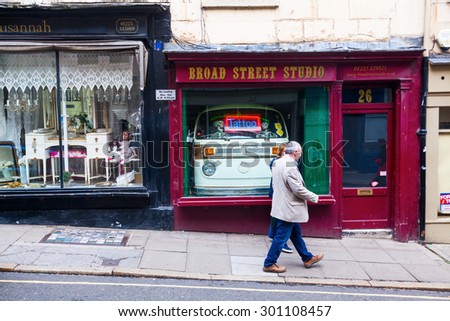 BATH, ENGLAND - JUNE 28, 2015: shop with a front of a VW Van in Bath, known for the curative Roman-built baths that still exist there and is a UNESCO world heritage site - with unidentified people