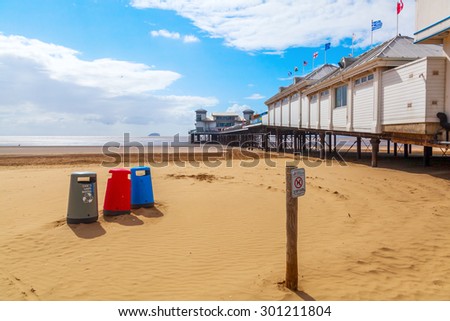 WESTON-SUPER-MARE - JULY 07, 2015: Grand Pier with unidentified people. The pier is a pleasure pier on the Bristol Channel, it has been damaged by fire 1930 and 2008. After 2008 fire new opened 2010