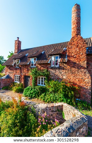 old building in Allerford, Somerset, England. Allerford is famous for its much photographed packhorse bridge and picturesque cottages