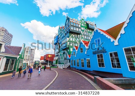 ZAANDAM, NETHERLANDS - SEPTEMBER 02, 2015: unique Inntel Hotel Zaandam with unidentified people.  The structure is a lively stacking of various examples of traditional houses found in the Zaan region
