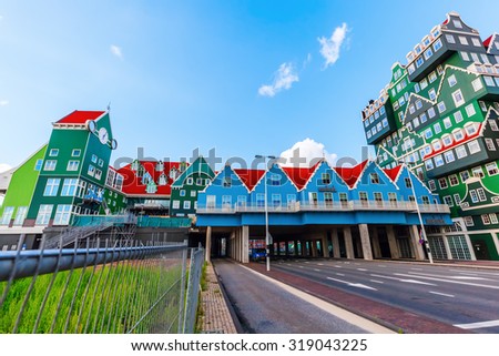 ZAANDAM, NETHERLANDS - SEPTEMBER 02, 2015: unique Inntel Hotel Zaandam with unidentified people.  The structure is a lively stacking of various examples of traditional houses found in the Zaan region