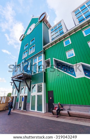 ZAANDAM, NETHERLANDS - SEPTEMBER 02, 2015: unique buildings in Zaandam with unidentified people. This buildings beside the Inntel Hotels are designed by WAM architects.