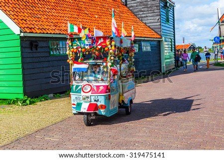 ZAANSE SCHANS, NETHERLANDS - SEPTEMBER 03, 2015: unidentified people at the museum village. A Collection of historic windmills and houses from the region were moved to the area starting 1961