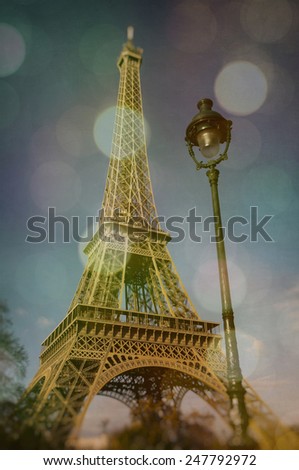 Eiffel Tower with lighting blur, bokeh and texture effects, vintage look
