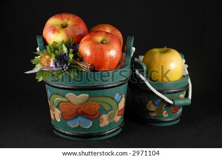 Apples in wooden buckets painted in Norwegian Rosemaling style.