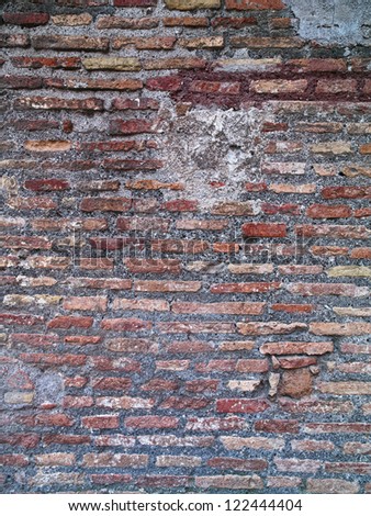 A brick wall with thin bricks and mortar